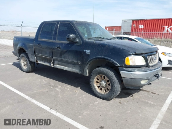 2003 Ford F-150 XLT with VIN 1FTRW08L83KA14760, listed as a IAAI auction lot 41820943 with 215,130 mi miles. Bid and sale history available at carsss.com. Image 1.