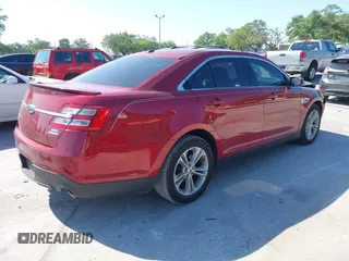 2014 Ford Taurus SEL with VIN 1FAHP2E86EG186642, listed as a IAAI auction lot 41901768 with 106,057 mi miles. Bid and sale history available at carsss.com. Image 4.