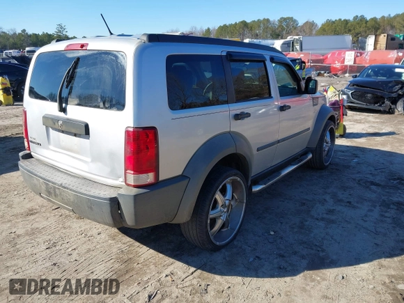 2007 Dodge Nitro SXT with VIN 1D8GT28K97W642118, listed as a IAAI auction lot 41276172 with 385,441 mi miles. Bid and sale history available at carsss.com. Image 4.