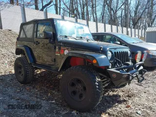 2015 Jeep Wrangler Sahara z VIN 1C4AJWBG7FL703858, wystawiony jako IAAI lot #41720656 z przebiegiem 110 671 mil mil oraz . Historia ofert i sprzedaży dostępna na DreamBid. Obrazek 1.