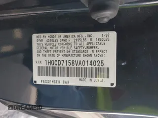 1997 Honda Accord EX w/Leather with VIN 1HGCD7158VA014025, listed as a IAAI auction lot 41582343 with 302,660 mi miles. Bid and sale history available at carsss.com. Image 9.