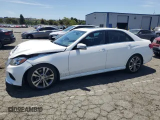 2014 Mercedes-Benz E 350 Sport with VIN WDDHF5KB0EB076168, listed as a Copart auction lot 58874915 with 127,061 mi miles and Salvage title. Bid and sale history available at DreamBid. Image 1.