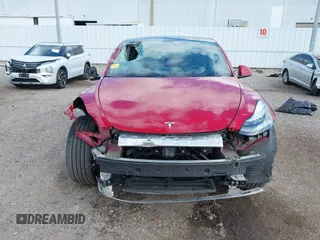 2020 Tesla Model Y Long Range with VIN 5YJYGDEE9LF009957, listed as a IAAI auction lot 41780248 with 31,053 mi miles and . Bid and sale history available at DreamBid. Image 13.