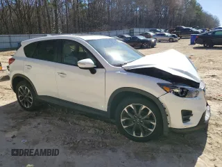 2016 Mazda CX-5 Grand Touring with VIN JM3KE4DY6G0857197, listed as a Copart auction lot 44500955 with 76,088 mi miles and Salvage Title. Bid and sale history available at DreamBid. Image 4.