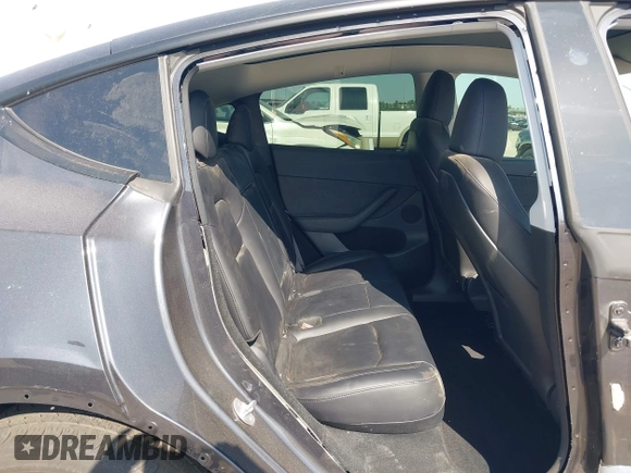 2024 Tesla Model Y with VIN 7SAYGDED2RF040745, listed as a IAAI auction lot 41986613 with 9,778 mi miles and . Bid and sale history available at DreamBid. Image 8.