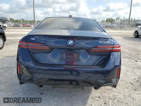 2024 BMW i5 eDrive40 with VIN WBY33FK09RCR50159, listed as a Copart auction lot 55520615 with 12,564 mi miles and Salvage title. Bid and sale history available at DreamBid. Image 6.
