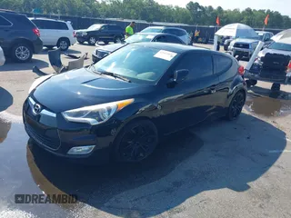 2012 Hyundai Veloster w/Black Int z VIN KMHTC6AD4CU078413, wystawiony jako IAAI lot #42611032 z przebiegiem 142 295 mil mil oraz . Historia ofert i sprzedaży dostępna na DreamBid. Obrazek 2.
