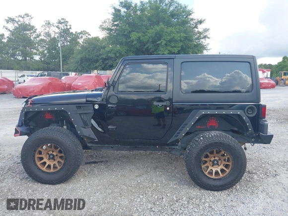 2012 Jeep Wrangler Sport z VIN 1C4AJWAG2CL286680, wystawiony jako IAAI lot #42434411 z przebiegiem 97 142 mil mil oraz . Historia ofert i sprzedaży dostępna na DreamBid. Obrazek 14.