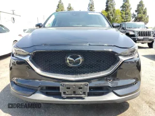 2018 Mazda CX-5 Grand Touring with VIN JM3KFBDM4J0348165, listed as a Copart auction lot 62733665 with 80,693 mi miles and Salvage title. Bid and sale history available at DreamBid. Image 5.