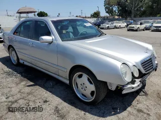 2000 Mercedes-Benz E with VIN WDBJF74J7YB055624, listed as a Copart auction lot 63880184 with 71,355 mi miles and Salvage Title. Bid and sale history available at DreamBid. Image 4.
