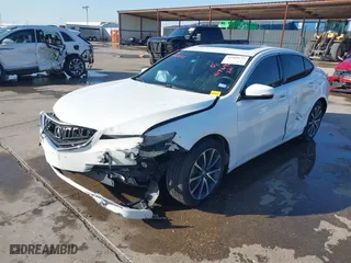 2015 Acura TLX V6 Advance with VIN 19UUB3F7XFA006457, listed as a IAAI auction lot 41969272 with 99,715 mi miles. Bid and sale history available at carsss.com. Image 2.