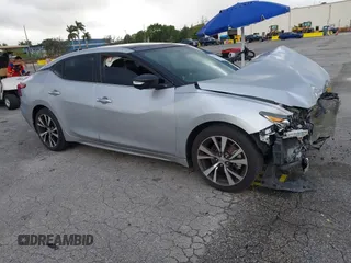 2016 Nissan Maxima Platinum z VIN 1N4AA6AP1GC419957, wystawiony jako IAAI lot #41127244 z przebiegiem 158 161 mil mil oraz . Historia ofert i sprzedaży dostępna na DreamBid. Obrazek 1.