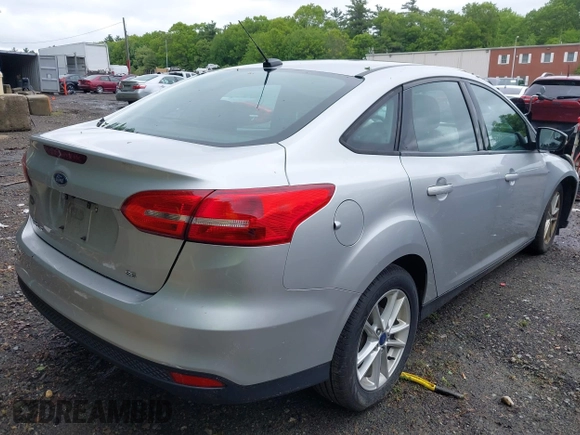 2016 Ford Focus SE z VIN 1FADP3F29GL353908, wystawiony jako IAAI lot #42289308 z przebiegiem 94 937 mil mil oraz . Historia ofert i sprzedaży dostępna na DreamBid. Obrazek 4.