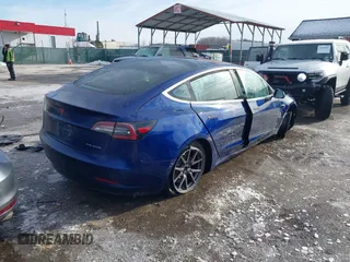 2018 Tesla Model 3 Long Range Battery with VIN 5YJ3E1EB8JF115138, listed as a IAAI auction lot 41343399 with 62,351 mi miles and . Bid and sale history available at DreamBid. Image 4.