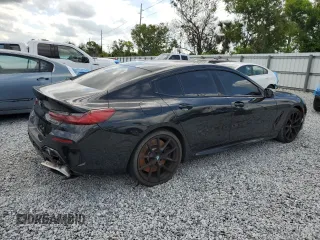2020 BMW 8 Series M850i z VIN WBAGV8C06LBP48901, wystawiony jako Copart lot #57595725 z przebiegiem 88 332 mil mil oraz Tytuł czysty. Historia ofert i sprzedaży dostępna na DreamBid. Obrazek 3.