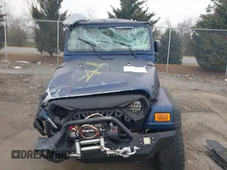 2003 Jeep Wrangler X with VIN 1J4FA39S23P300447, listed as a IAAI auction lot 41791733 with 165,576 mi miles. Bid and sale history available at carsss.com. Image 12.