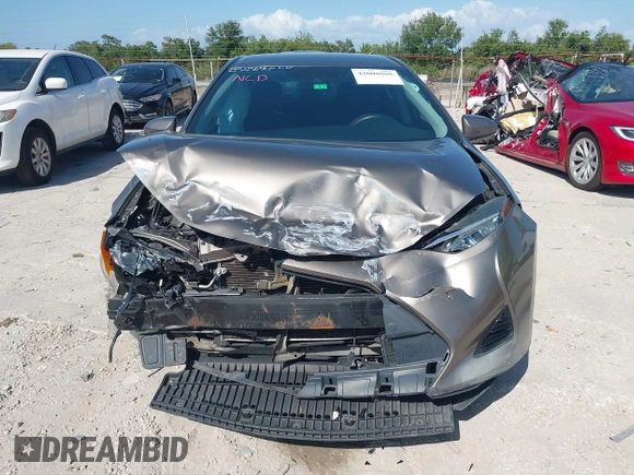 2019 Toyota Corolla L with VIN 5YFBURHE7KP878972, listed as a IAAI auction lot 42000888 with 201,612 mi miles. Bid and sale history available at carsss.com. Image 12.