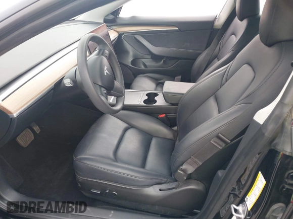 2023 Tesla Model 3 with VIN 5YJ3E1EA5PF647737, listed as a IAAI auction lot 42430145 with 20,525 mi miles and . Bid and sale history available at DreamBid. Image 5.
