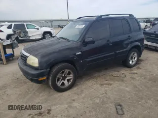2003 Suzuki Grand Vitara z VIN JS3TE62V834101506, wystawiony jako Copart lot #47094765 z przebiegiem 240 778 mil mil oraz Szkoda całkowita • Salvage title. Historia ofert i sprzedaży dostępna na DreamBid. Obrazek 1.