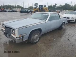 1983 Cadillac Eldorado z VIN 1G6AL5787DE620683, wystawiony jako Copart lot #73325114 z przebiegiem 20 355 mil mil oraz Szkoda całkowita • Salvage title. Historia ofert i sprzedaży dostępna na DreamBid. Obrazek 1.