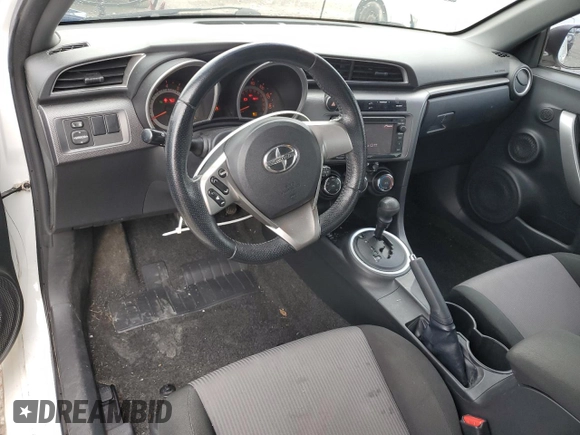 2014 Scion tC z VIN JTKJF5C70E3084411, wystawiony jako Copart lot #54255385 z przebiegiem 152 715 mil mil oraz Szkoda całkowita • Salvage title. Historia ofert i sprzedaży dostępna na DreamBid. Obrazek 8.