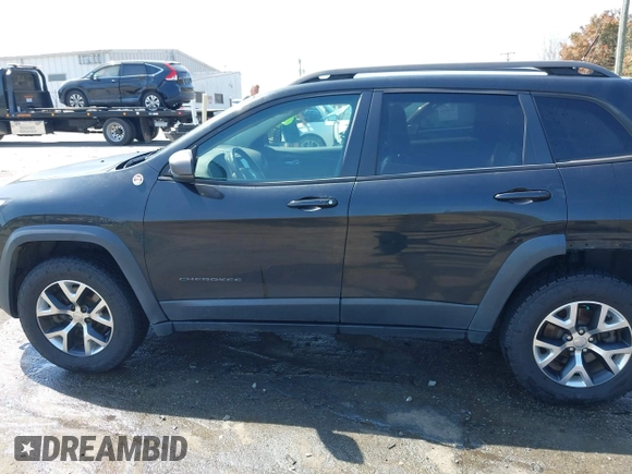 2014 Jeep Cherokee Trailhawk with VIN 1C4PJMBB6EW162303, listed as a IAAI auction lot 41910167 with 133,669 mi miles. Bid and sale history available at carsss.com. Image 15.