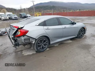 2019 Honda Civic Sport with VIN 19XFC2F81KE034047, listed as a IAAI auction lot 41995614 with 91,303 mi miles and . Bid and sale history available at DreamBid. Image 4.