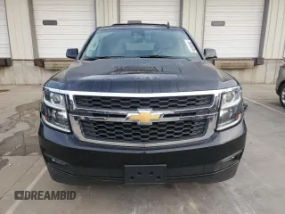 2019 Chevrolet Tahoe LT with VIN 1GNSKBKC2KR349527, listed as a Copart auction lot 58496695 with 128,590 mi miles and Salvage title. Bid and sale history available at DreamBid. Image 5.