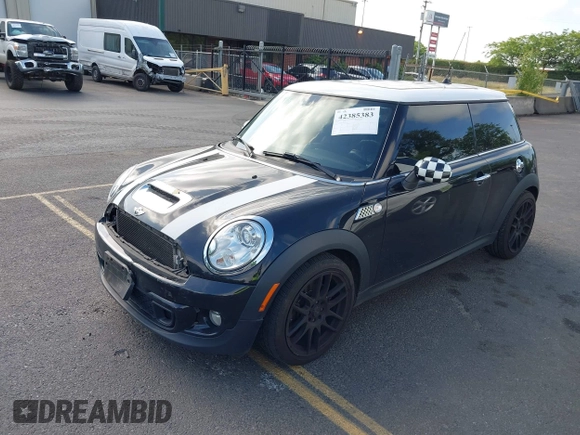 2013 MINI Hardtop S with VIN WMWSV3C53DT477574, listed as a IAAI auction lot 42385383 with 81,312 mi miles and . Bid and sale history available at DreamBid. Image 2.