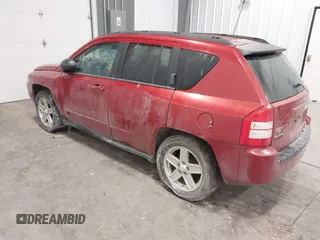 2010 Jeep Compass Sport with VIN 1J4NF4FB2AD506051, listed as a IAAI auction lot 41552084 with 218,785 mi miles. Bid and sale history available at carsss.com. Image 3.