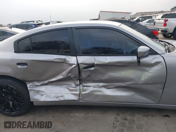 2015 Dodge Charger SXT with VIN 2C3CDXHG4FH884058, listed as a IAAI auction lot 41724894 with 202,701 mi miles and . Bid and sale history available at DreamBid. Image 14.