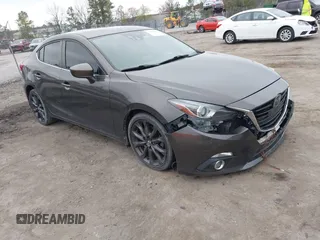 2014 Mazda 3 S Grand Touring with VIN JM1BM1W39E1145186, listed as a IAAI auction lot 41948404 with 111,702 mi miles and . Bid and sale history available at DreamBid. Image 1.