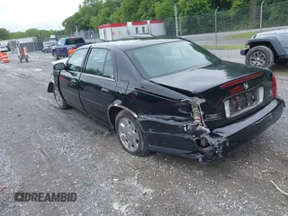 2002 Cadillac DeVille DTS z VIN 1G6KF579320288667, wystawiony jako IAAI lot #42331236 z przebiegiem 71 189 mil mil oraz . Historia ofert i sprzedaży dostępna na DreamBid. Obrazek 3.
