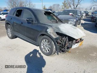 2015 Mazda CX-5 Sport z VIN JM3KE2BEXF0473564, wystawiony jako IAAI lot #41408107 z przebiegiem Nie podano mil oraz . Historia ofert i sprzedaży dostępna na DreamBid. Obrazek 1.