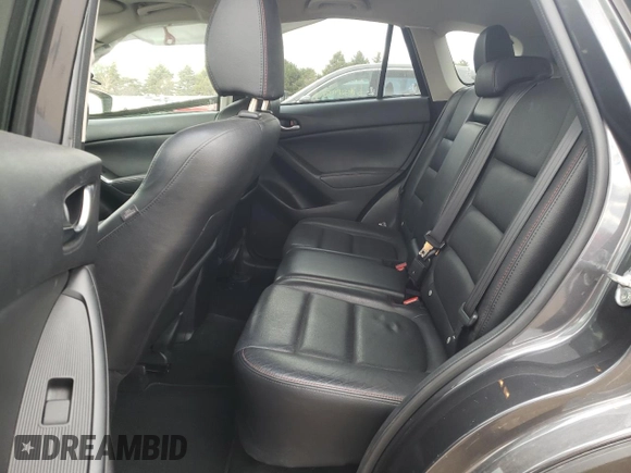 2015 Mazda CX-5 Grand Touring with VIN JM3KE4DY2F0526535, listed as a Copart auction lot 53046855 with 90,288 mi miles and Salvage Title. Bid and sale history available at DreamBid. Image 10.