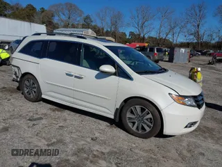 2014 Honda Odyssey Touring with VIN 5FNRL5H90EB053451, listed as a IAAI auction lot 41377042 with 138,000 mi miles and . Bid and sale history available at carsss.com. Image 1.