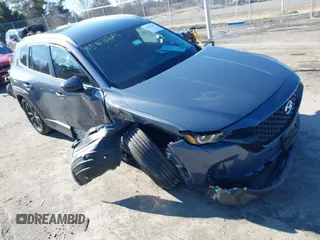 2024 Mazda CX-50 S Select with VIN 7MMVABAMXRN238079, listed as a IAAI auction lot 41563281 with 5,576 mi miles and . Bid and sale history available at DreamBid. Image 1.