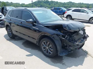 2023 Volkswagen Tiguan SE with VIN 3VVNB7AX5PM017938, listed as a IAAI auction lot 42453818 with 177,906 mi miles and . Bid and sale history available at DreamBid. Image 1.