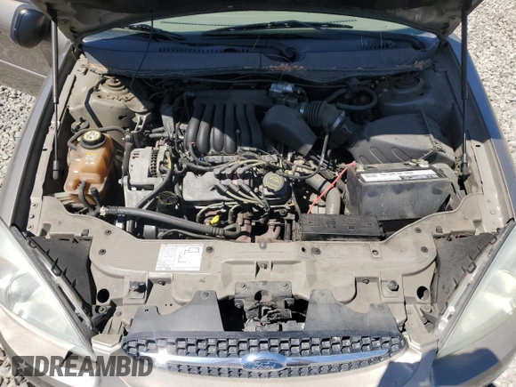 2003 Ford Taurus LX Standard z VIN 1FAFP52U63G277370, wystawiony jako Copart lot #56184345 z przebiegiem 115 778 mil mil oraz Szkoda całkowita • Salvage title. Historia ofert i sprzedaży dostępna na DreamBid. Obrazek 11.