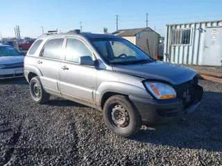 2006 Kia Sportage LX z VIN KNDJE723X67242610, wystawiony jako IAAI lot #41735144 z przebiegiem 244 979 mil mil oraz . Historia ofert i sprzedaży dostępna na DreamBid. Obrazek 1.