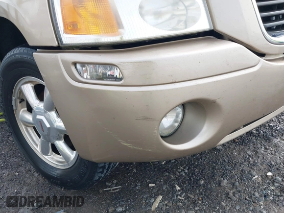 2005 GMC Envoy SLT with VIN 1GKDS13S452141376, listed as a IAAI auction lot 42095025 with 198,911 mi miles and . Bid and sale history available at DreamBid. Image 6.