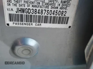 2007 Honda Fit z VIN JHMGD38487S045082, wystawiony jako Copart lot #59336665 z przebiegiem 73 754 mil mil oraz Szkoda całkowita • Salvage title. Historia ofert i sprzedaży dostępna na DreamBid. Obrazek 13.