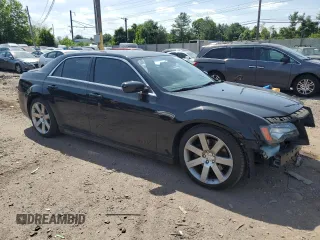 2012 Chrysler 300 SRT8 with VIN 2C3CCAFJ6CH800641, listed as a Copart auction lot 61313094 with 107,426 mi miles and Salvage Title. Bid and sale history available at carsss.com. Image 4.