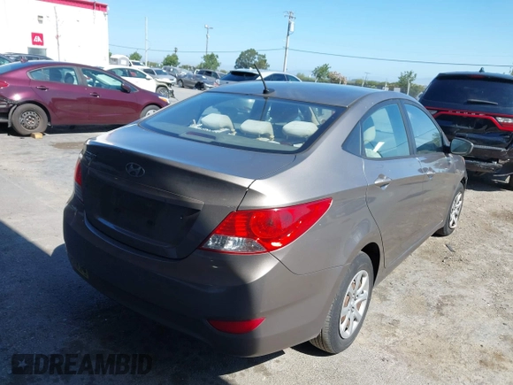 2014 Hyundai Accent GLS z VIN KMHCT4AE9EU671748, wystawiony jako IAAI lot #42356469 z przebiegiem 179 390 mil mil oraz . Historia ofert i sprzedaży dostępna na DreamBid. Obrazek 4.