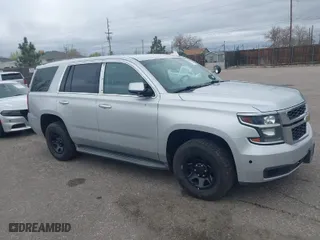 2015 Chevrolet Tahoe Commercial with VIN 1GNSK2ECXFR681555, listed as a IAAI auction lot 41975359 with 126,785 mi miles. Bid and sale history available at carsss.com. Image 1.