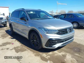 2022 Volkswagen Tiguan SE R-Line Black with VIN 3VVCB7AX4NM008121, listed as a IAAI auction lot 41671382 with 71,674 mi miles and . Bid and sale history available at DreamBid. Image 1.
