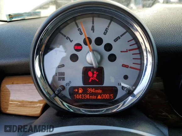 2009 MINI Hardtop S with VIN WMWMF73549TT94143, listed as a Copart auction lot 52120615 with 144,334 mi miles and Salvage Title. Bid and sale history available at DreamBid. Image 9.