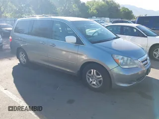 2006 Honda Odyssey EX-L z VIN 5FNRL38766B102432, wystawiony jako IAAI lot #42356315 z przebiegiem 214 261 mil mil oraz . Historia ofert i sprzedaży dostępna na DreamBid. Obrazek 1.