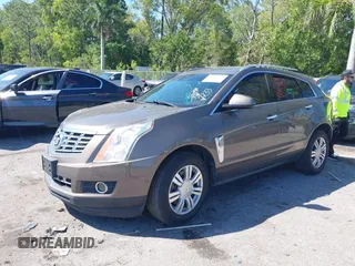 2014 Cadillac SRX Luxury Collection z VIN 3GYFNEE3XES587233, wystawiony jako IAAI lot #41747779 z przebiegiem 116 571 mil mil oraz . Historia ofert i sprzedaży dostępna na DreamBid. Obrazek 2.