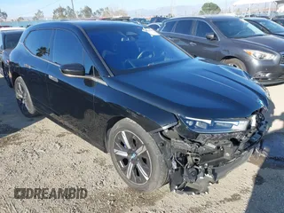 2022 BMW iX xDrive50 with VIN WB523CF07NCJ80006, listed as a IAAI auction lot 41631767 with 28,311 mi miles. Bid and sale history available at carsss.com. Image 1.